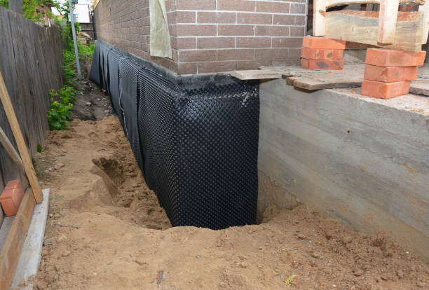 SJ Waterproofing Pros technician performing targeted Basement Waterproofing assessment in Marion, KS